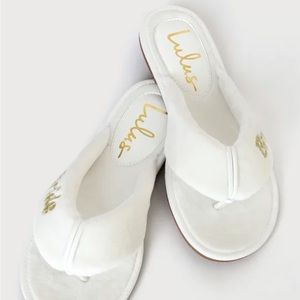 Bride getting ready white flip flops